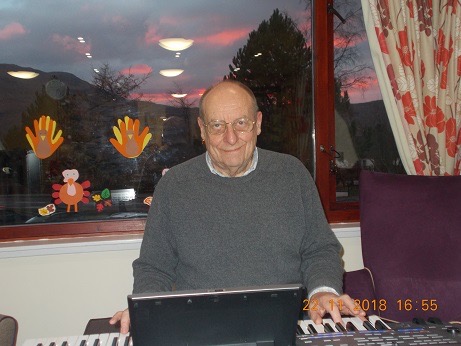 Old man playing piano